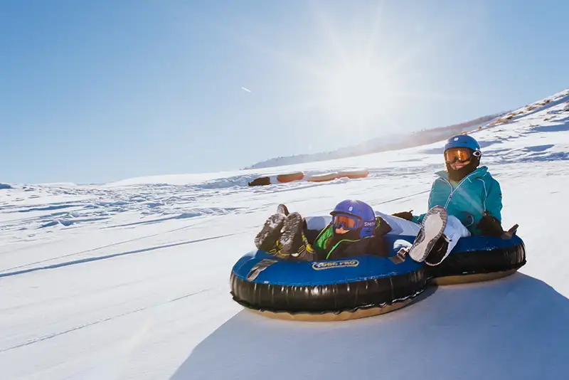 snow tubing down the hill