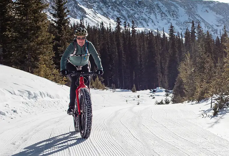 Rider on a fat bike on a snow-covered road