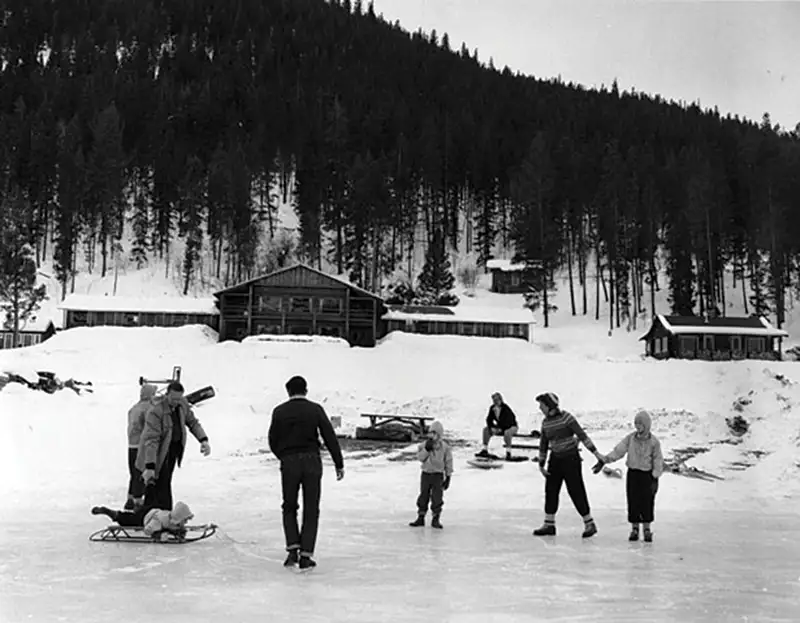 Historical photo of ice skaters on the pond